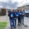 Alex Clarkson with the Conservative Candidates for Bandley Hill & Poplars Ward. They are stood in a residential road with houses and cars in the background.